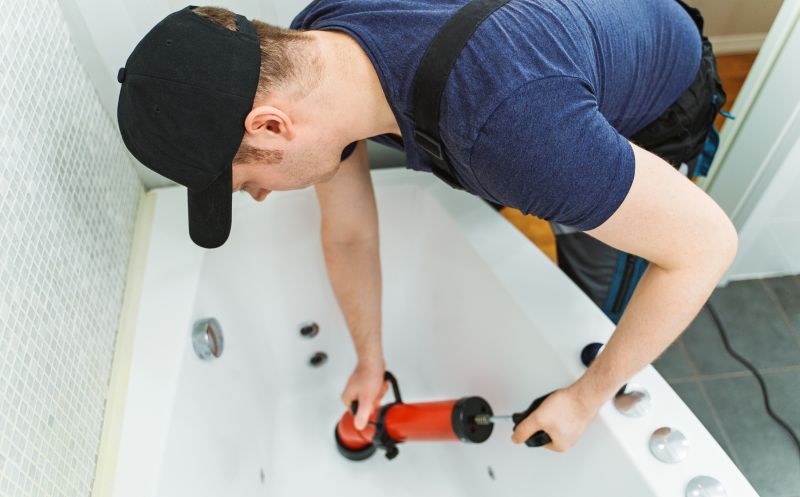 Plumber Installing Bathtub